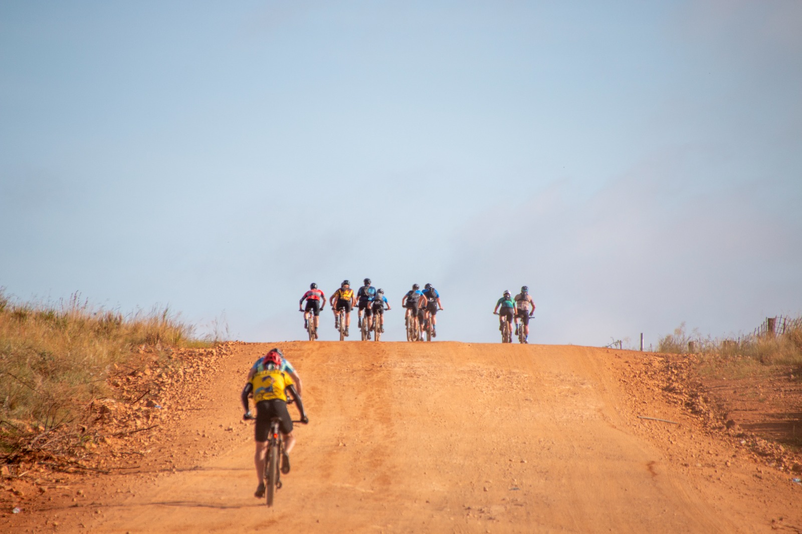 cyclists leaving on dirt road